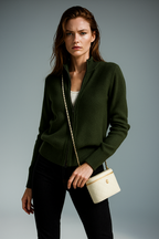 Dark green zip-up cardigan with ribbed knit, stand collar, and front zipper