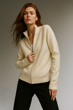 Ivory zip-up cardigan sweater with ribbed cuffs and hem, full front zipper.