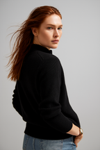 Black zip-up cardigan with ribbed knit, long sleeves, and front zipper detail