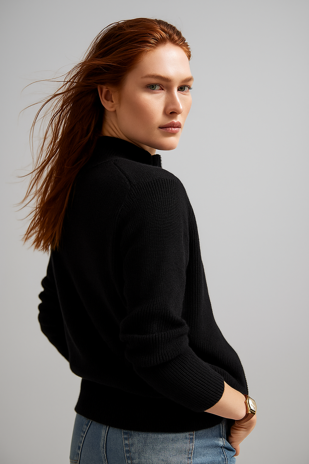 Black zip-up cardigan with ribbed knit, long sleeves, and front zipper detail