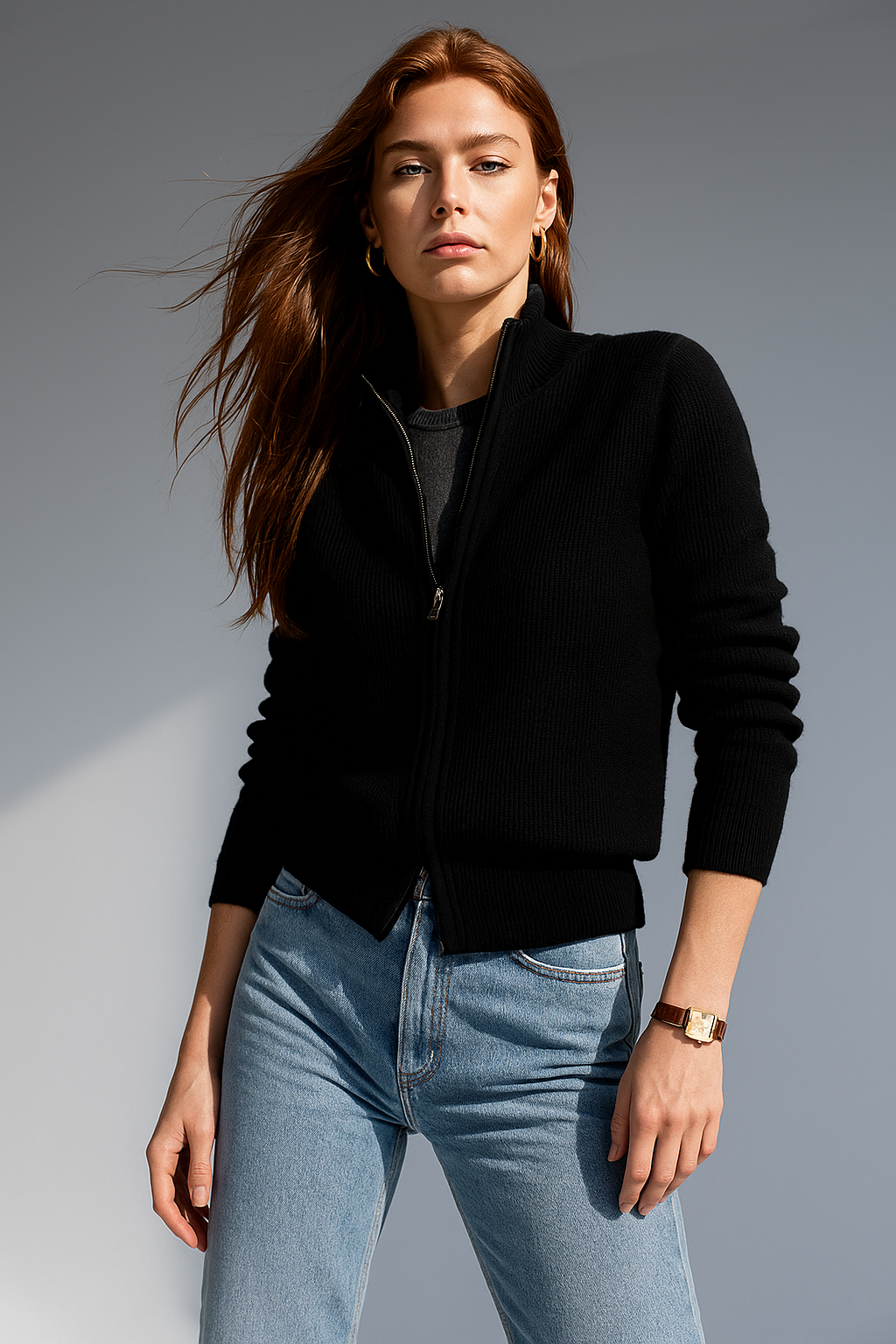 Black zip-up cardigan with ribbed knit texture, stand collar, and front zipper
