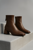 Brown genuine leather ankle boots with square toe, side zip pull, block heel.