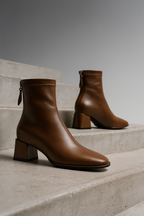 Dark brown genuine leather ankle boots with square toe, side zip pull, block heel.