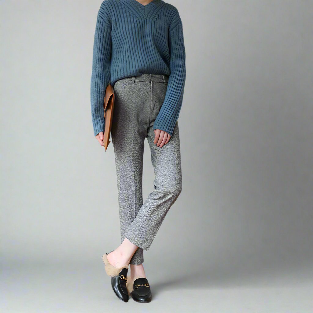 High-waisted gray trousers with belt loops, front seams, and tapered straight-leg fit