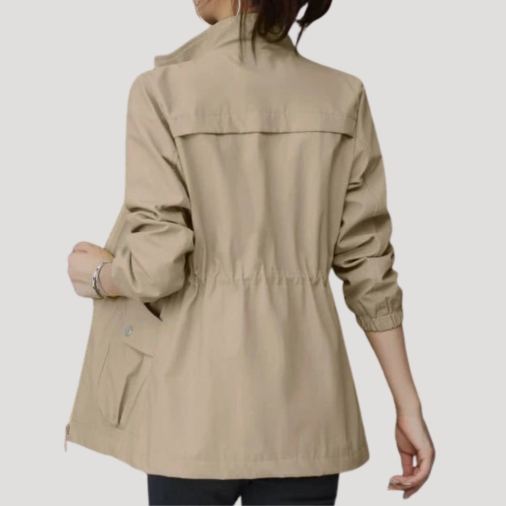 Light khaki women’s zip-front windbreaker with flap pockets and drawstring hem