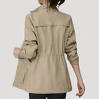 Light khaki women’s zip-front windbreaker with flap pockets and drawstring hem