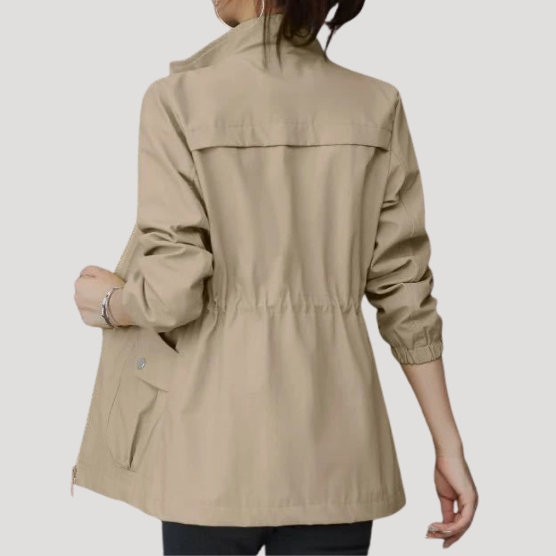 Light khaki women’s zip-front windbreaker with flap pockets and drawstring hem