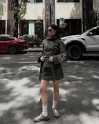 Army green cropped trench coat with button front and belted waist