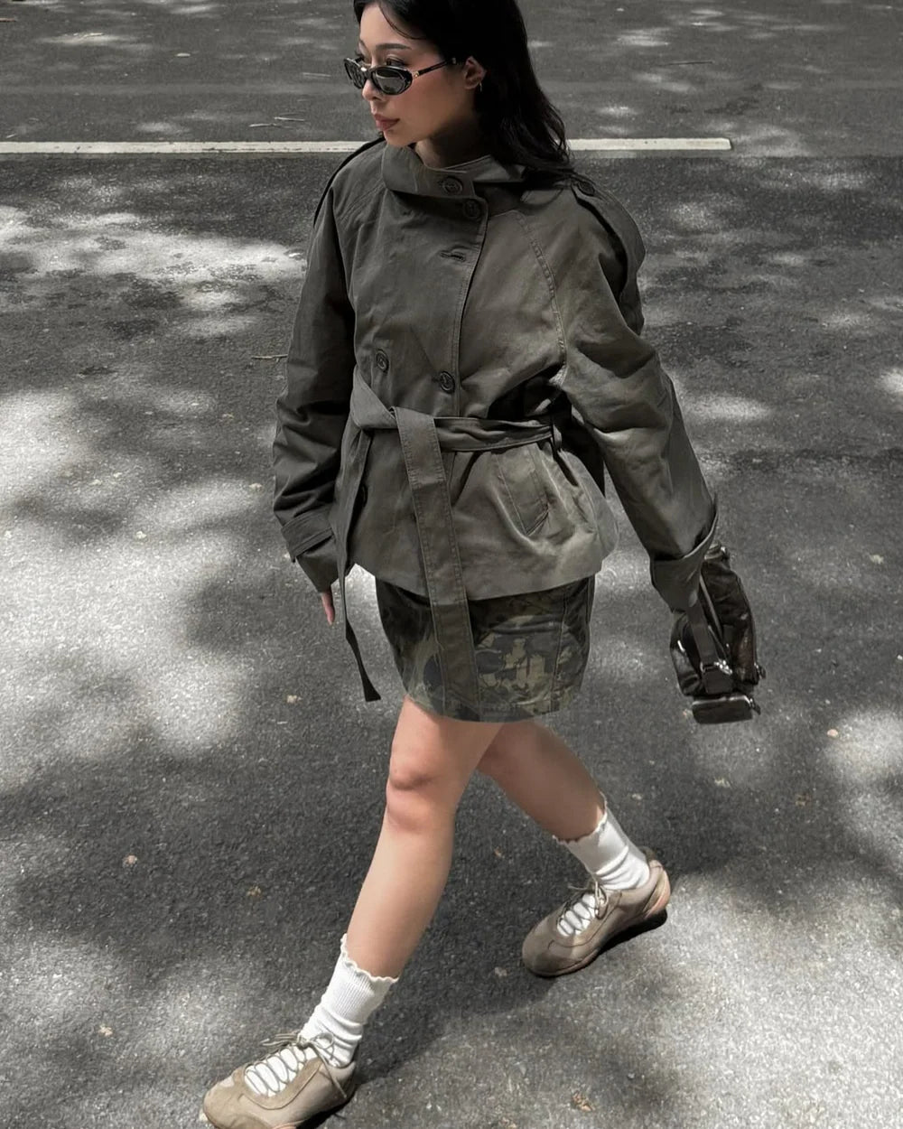 Cropped trench coat in army green with button front and tied waist belt