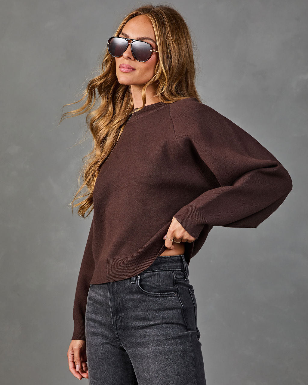 Wine crewneck knit sweater with dropped shoulders and long, loose sleeves