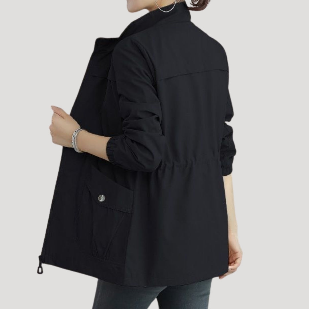 Black women’s zip-front windbreaker with flap pockets and roomy relaxed fit