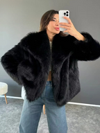 Oversized faux fur jacket in black with wide lapels and button front