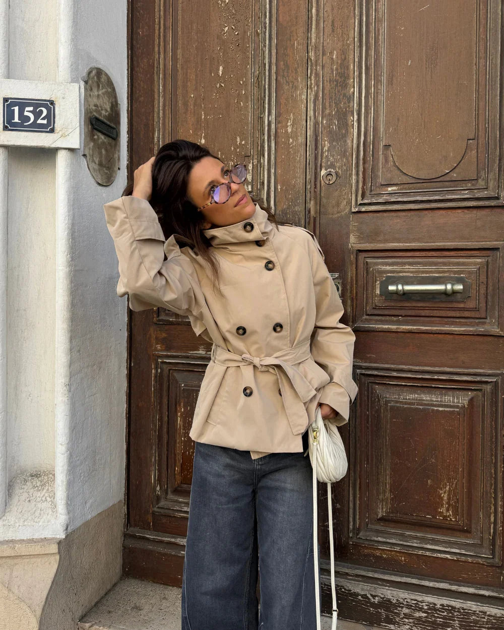 Cropped trench coat in beige with double-breasted buttons and belt tie waist
