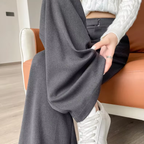 Women's high-rise wide-leg trousers, gray; front pleats and side pocket detail.