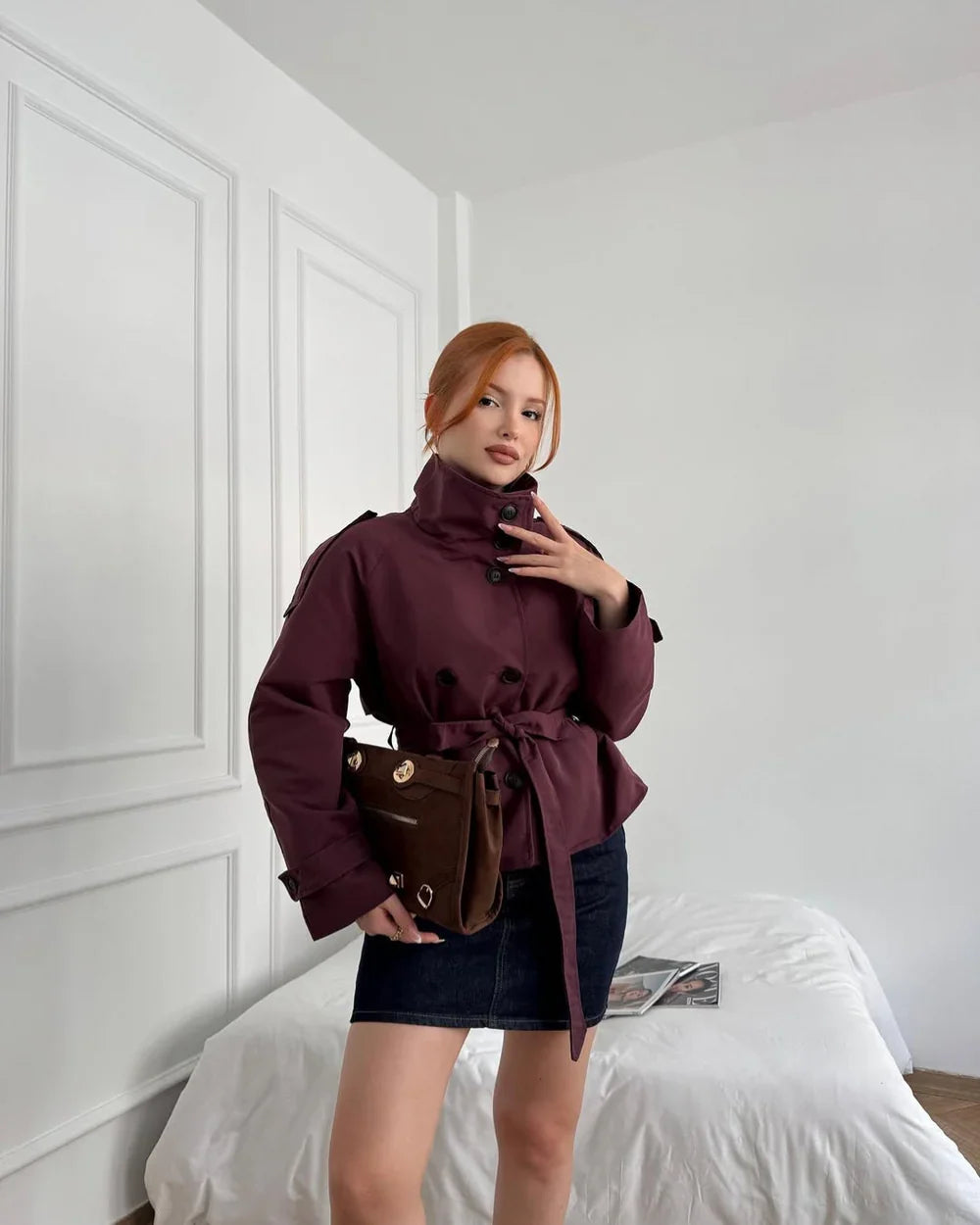 Cropped trench coat in burgundy with high neck and tied waist belt