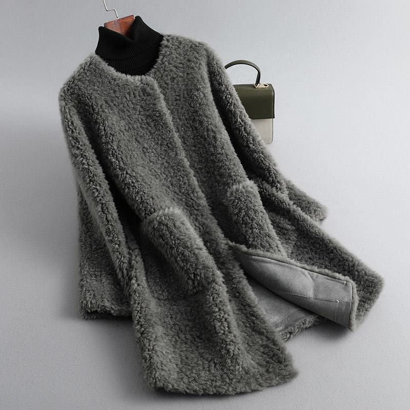 Gray shearling coat with ribbed black turtleneck, long sleeves, open front lining