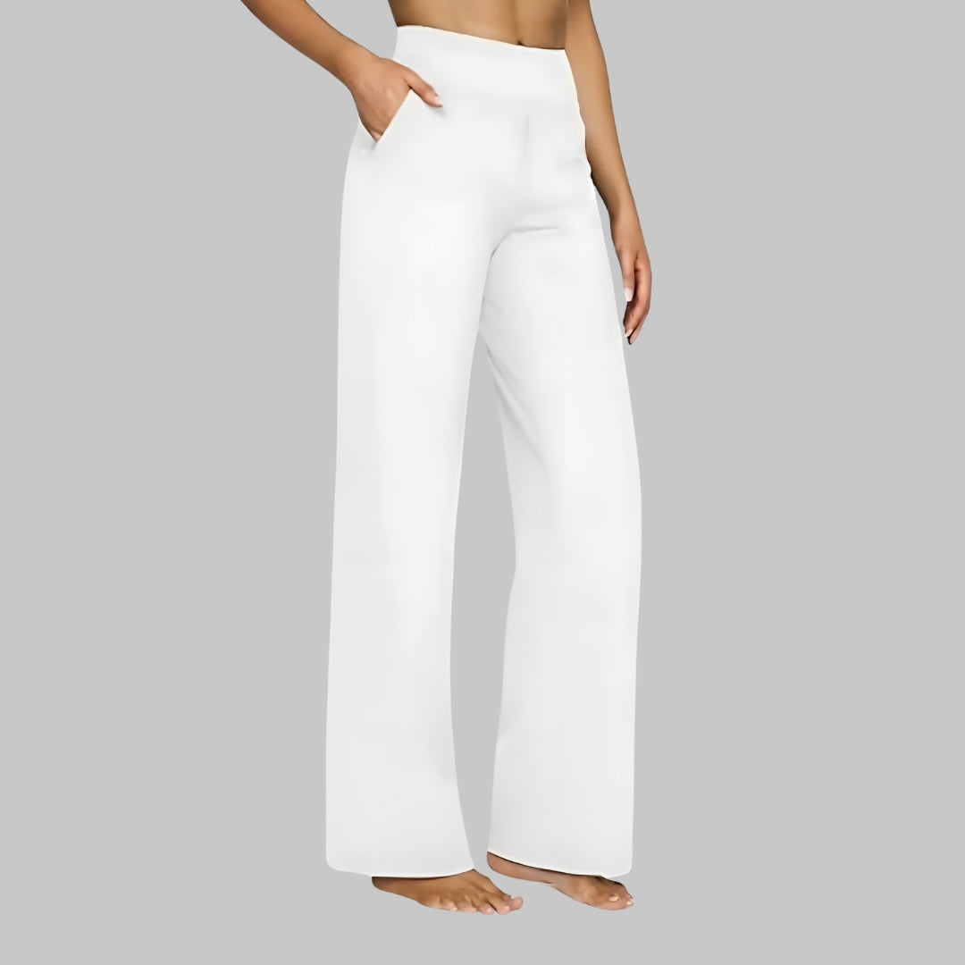 White high-waisted yoga pants with wide straight legs and smooth pull-on fit