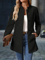 Women’s mid-length winter coat, black, front view with round button detail