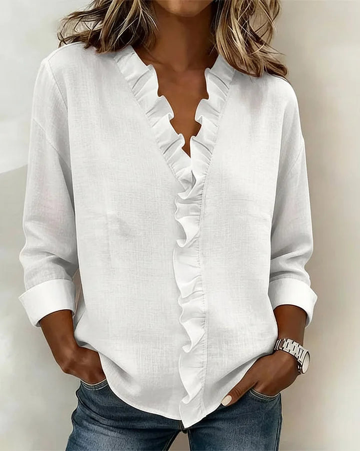 White ruffle-trim V-neck blouse with long sleeves
