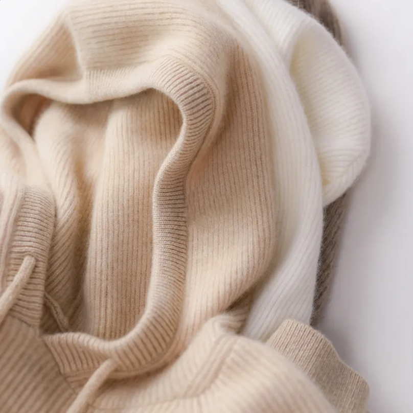 Women’s hoodie hood lining close-up in light beige knit with ribbed trim