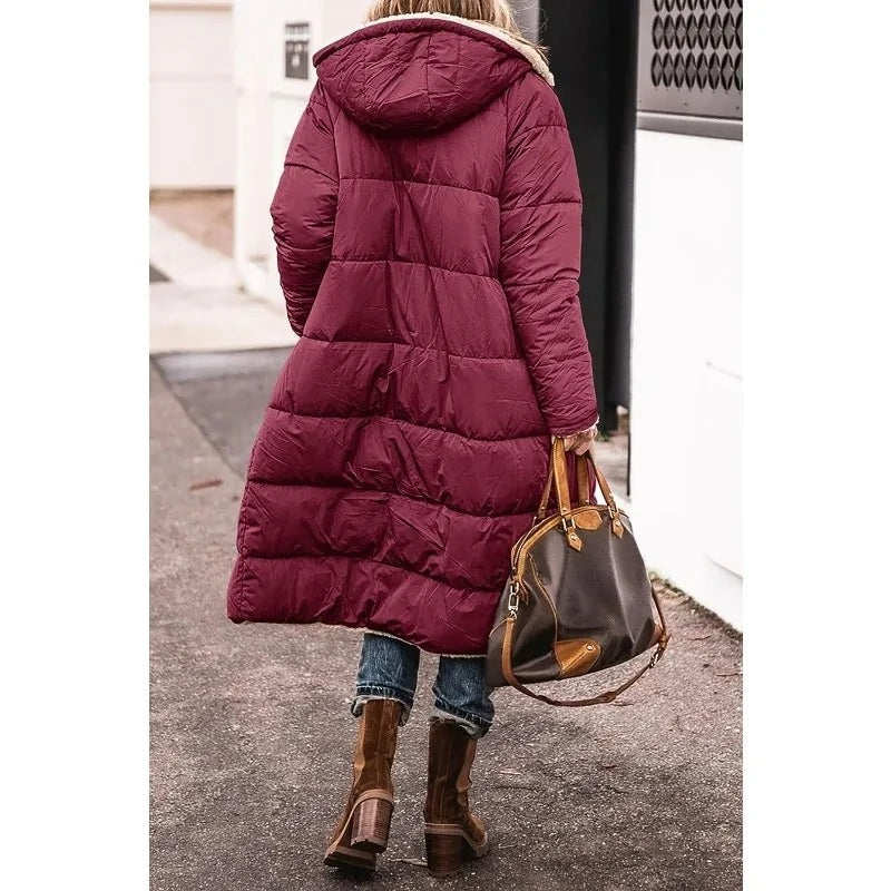 Burgundy longline puffer jacket with hood and tan sherpa lining at the collar