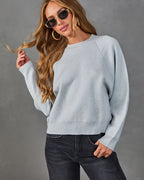 Heather grey crewneck knit sweater with long sleeves and cuff details