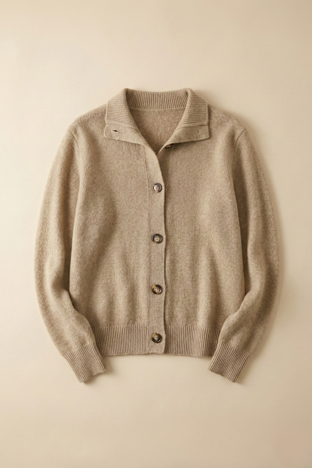 Camel button cardigan sweater with collared placket and ribbed hem.