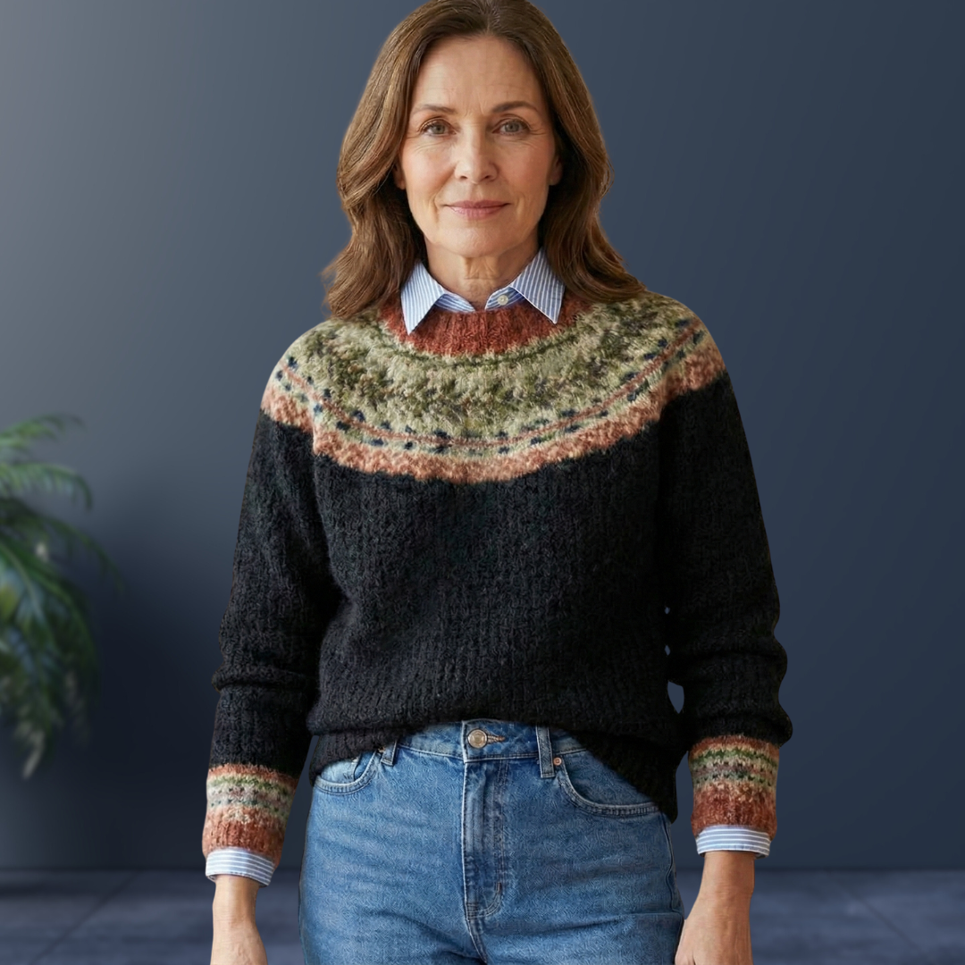 Black knit sweater with multicolor fair isle yoke and ribbed cuffs and hem.