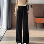 Women's high-rise wide-leg trousers, black with front pleats and wide straight legs.
