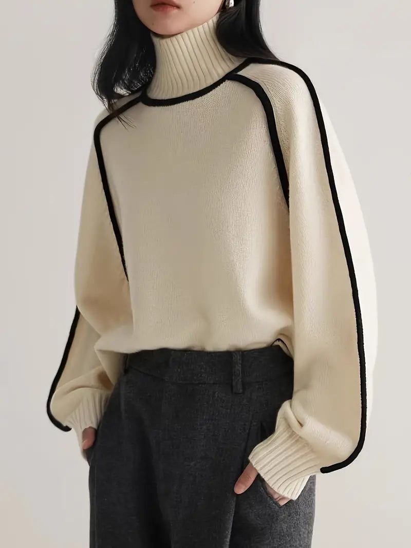 Cream turtleneck knit sweater with black trim along neckline and sleeves