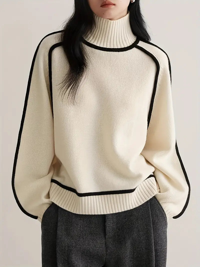 Cream turtleneck knit sweater with black-trim neckline and cuffs