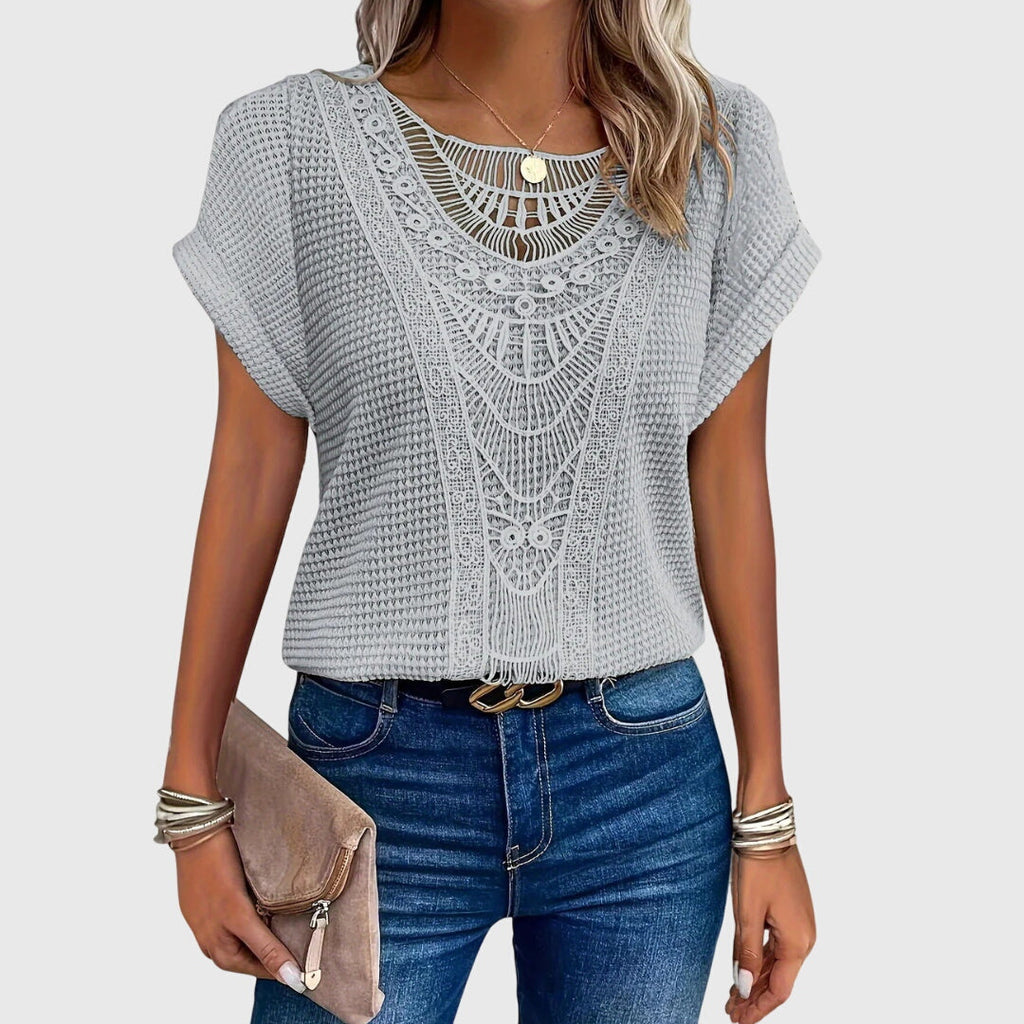 Light gray crochet blouse with lace-like yoke and short flutter sleeves