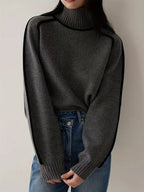 Dark gray turtleneck knit sweater with ribbed cuffs and hem