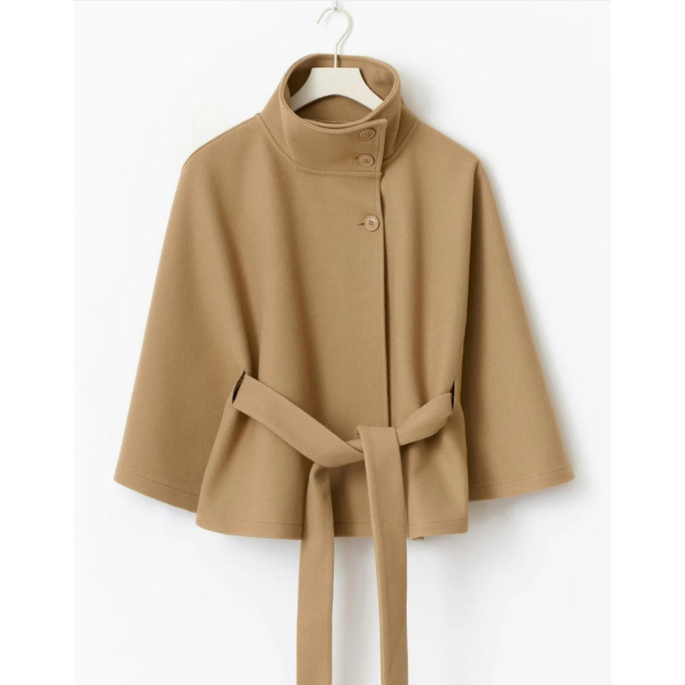 Women's high-collar cape coat in tan, front view with button placket and belt tie