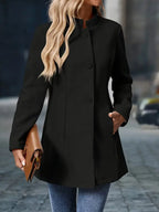 Women’s mid-length winter coat, black, front view with button stand collar
