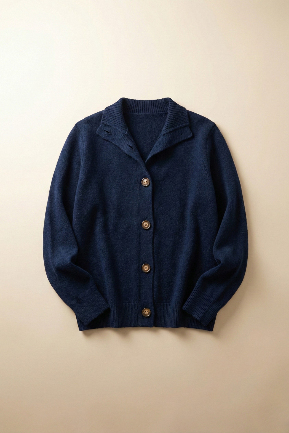 Navy button cardigan sweater with V-neck and ribbed trim.