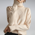 Women’s cashmere turtleneck sweater in cream, diamond knit pattern, ribbed high neck and cuffs.