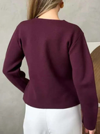 Women’s burgundy boxy V-neck cardigan sweater, back view, long sleeves, buttoned