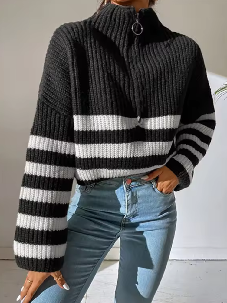 Black half-zip knit sweater with black-and-white horizontal stripe bands and ribbed collar