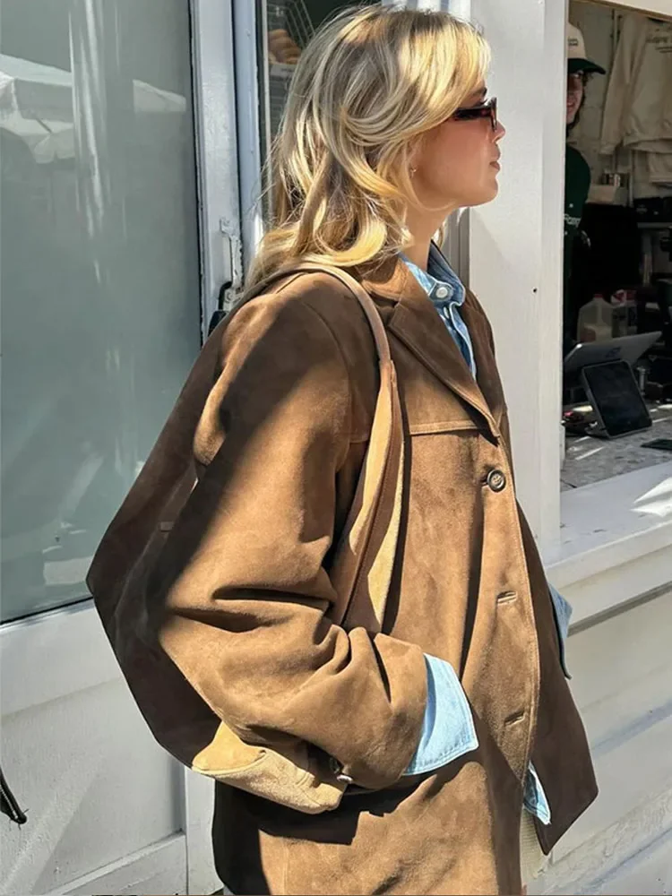 Women's brown suede-look button jacket from the back/side with structured shoulders