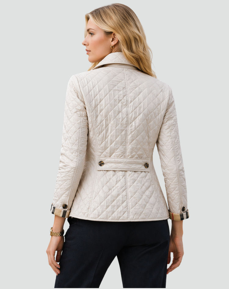 Women's quilted jacket back view, light color, button cuffs and waist belt detail