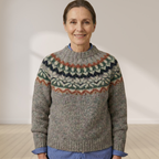 Gray knit sweater with Nordic fair isle yoke in dark green, orange, and cream tones.
