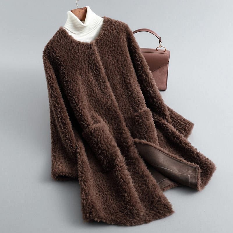 Dark brown shearling coat with ribbed white turtleneck, long sleeves, curved hem
