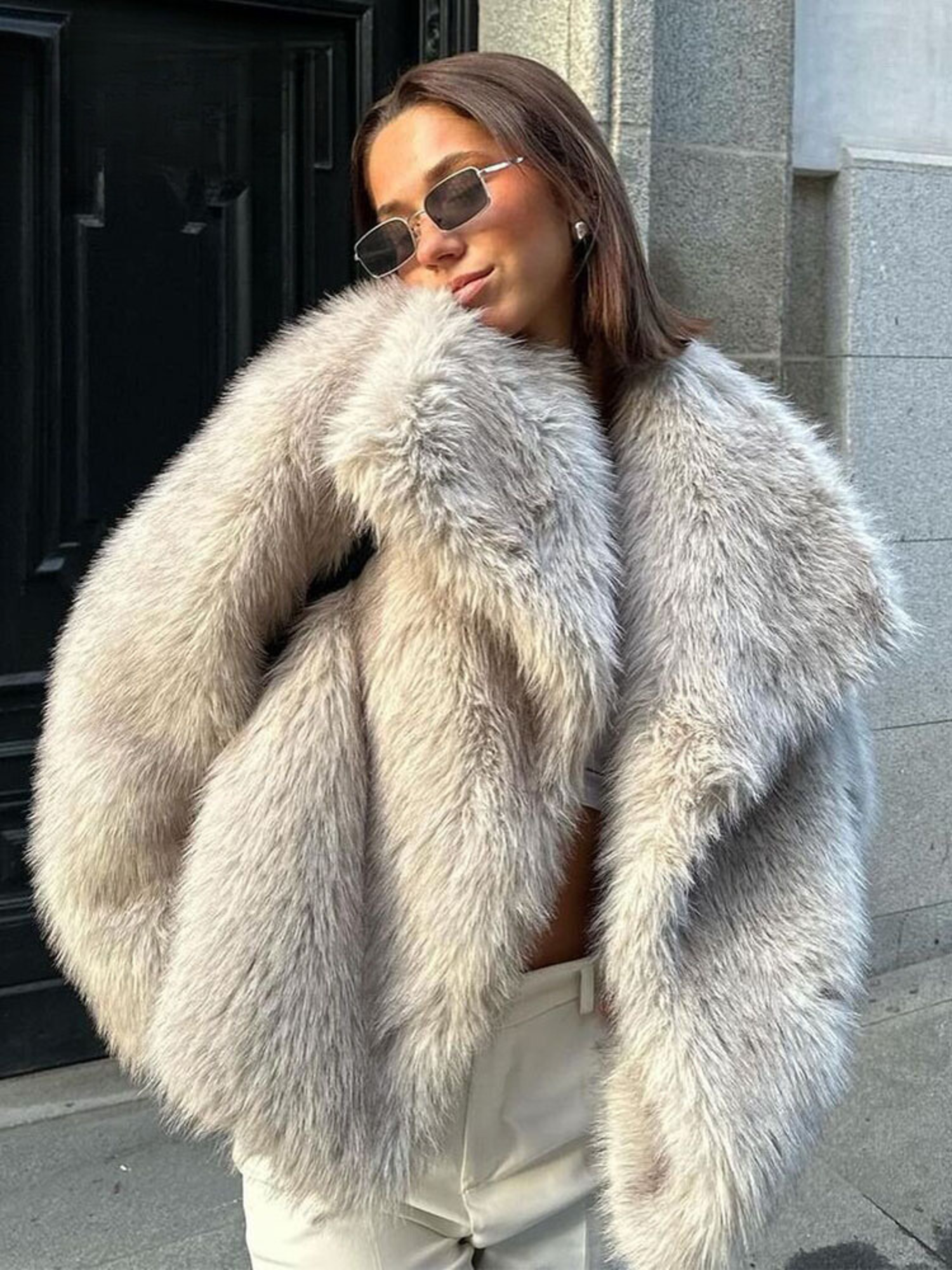 Oversized faux fur jacket in cream with relaxed shoulders and button front