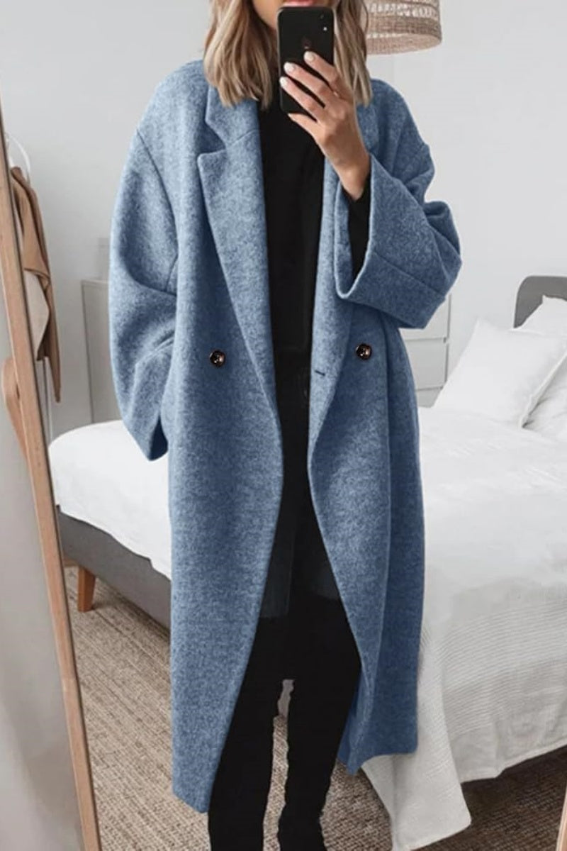 Women’s long wool double-breasted coat in blue with notch lapels and long sleeves