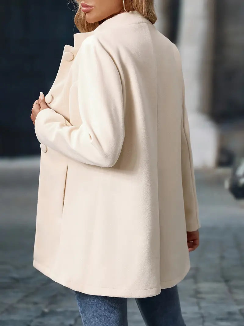 Women’s mid-length winter coat, cream, back view with stand collar