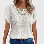 White crochet blouse with lace-like neckline and short flutter sleeves