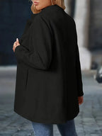 Women’s mid-length winter coat, black, back view with stand collar
