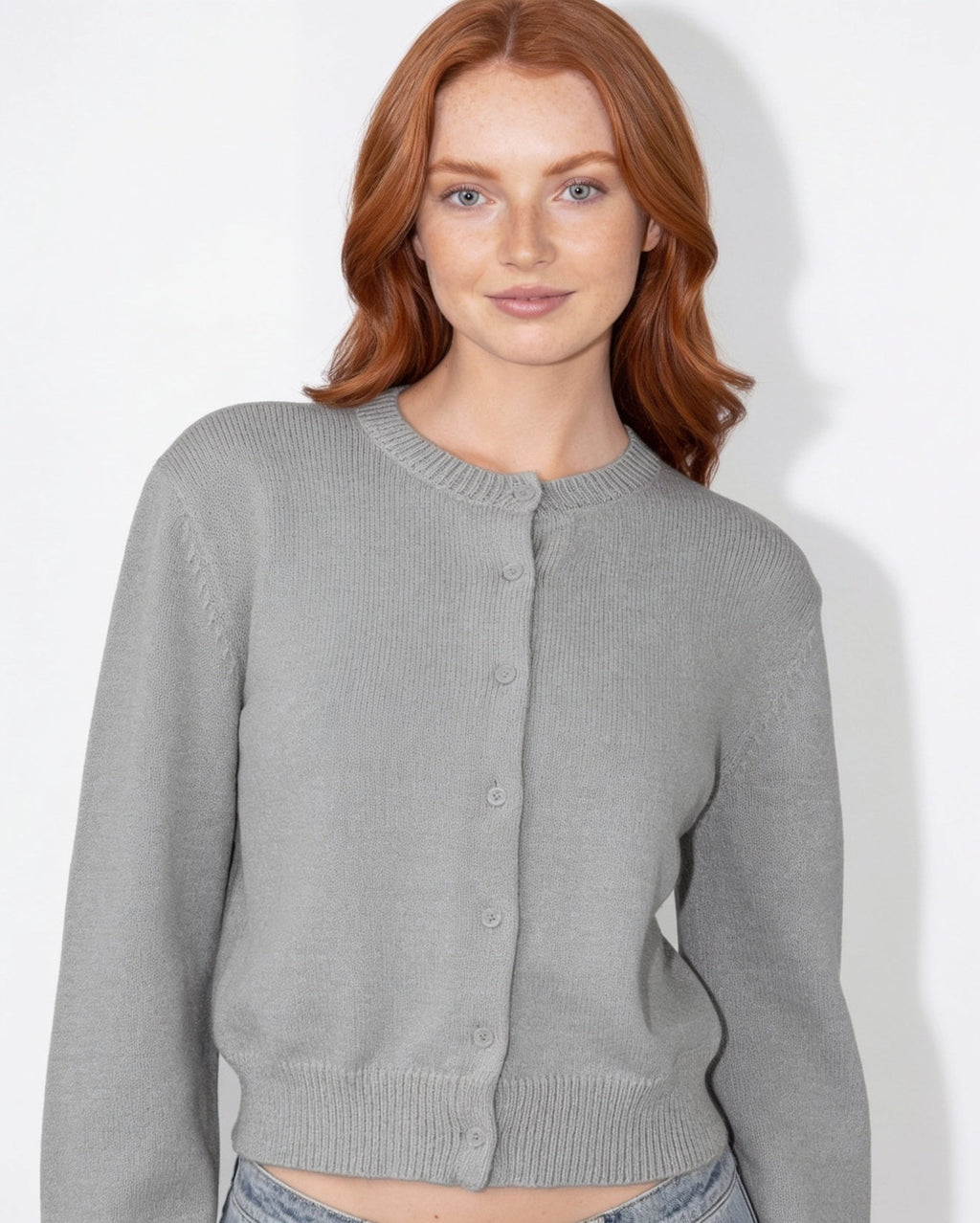 Grey round-neck knit cardigan with button-front and ribbed cuffs, cropped length
