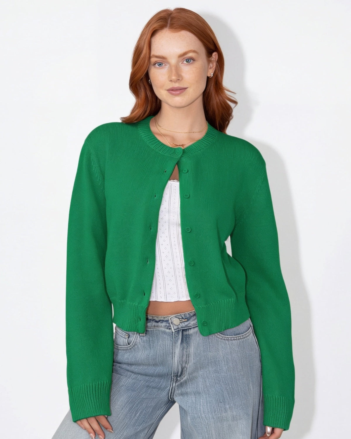 Green cropped knit cardigan with round neck and button-front, long sleeves.